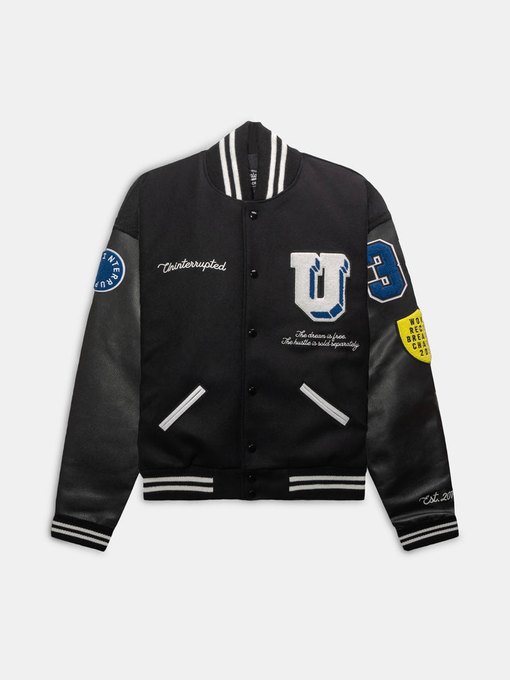 Front view of our black lettermen varsity jacket with leather sleeves and several patches