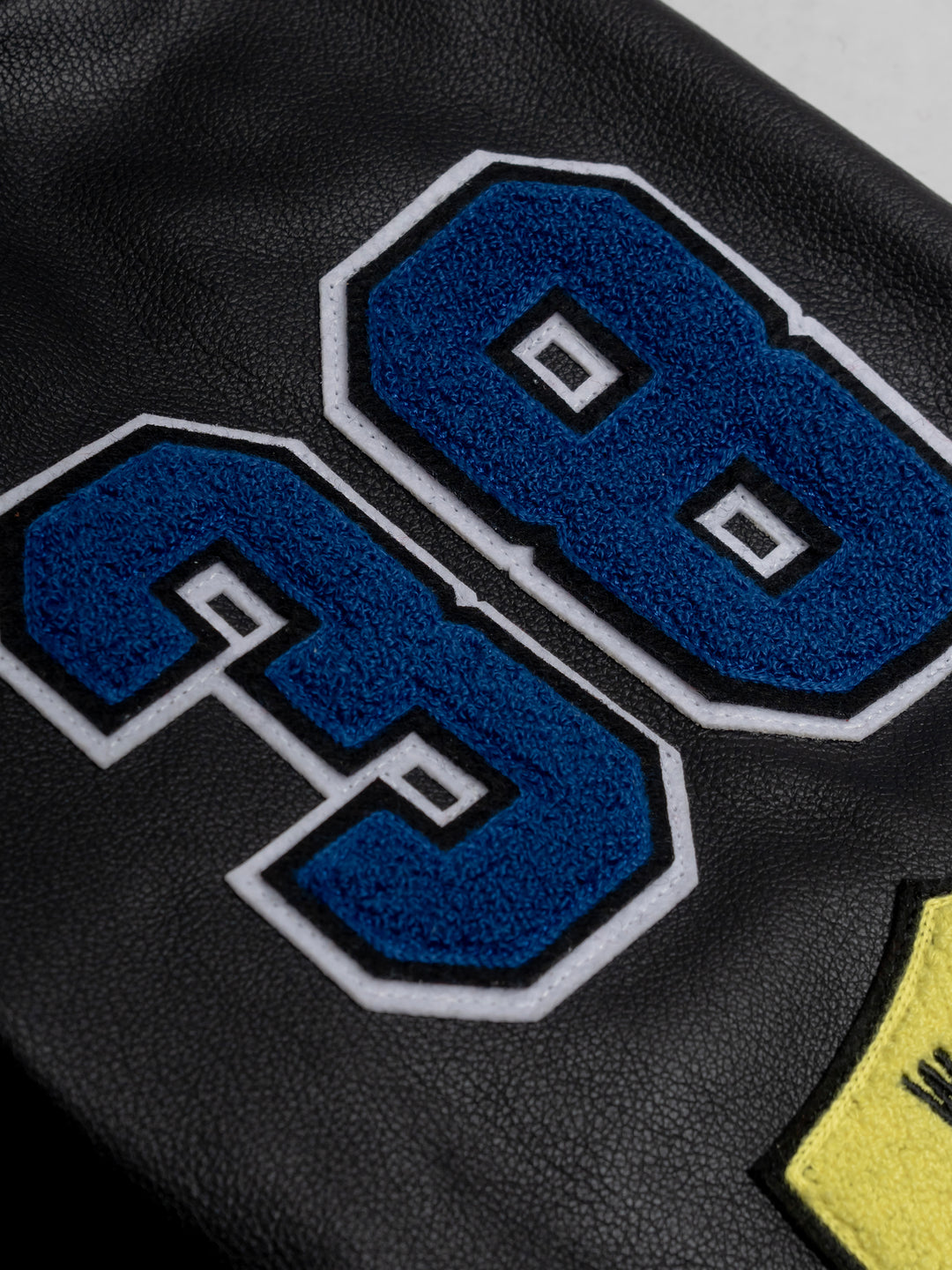 close up of a blue "38" patch