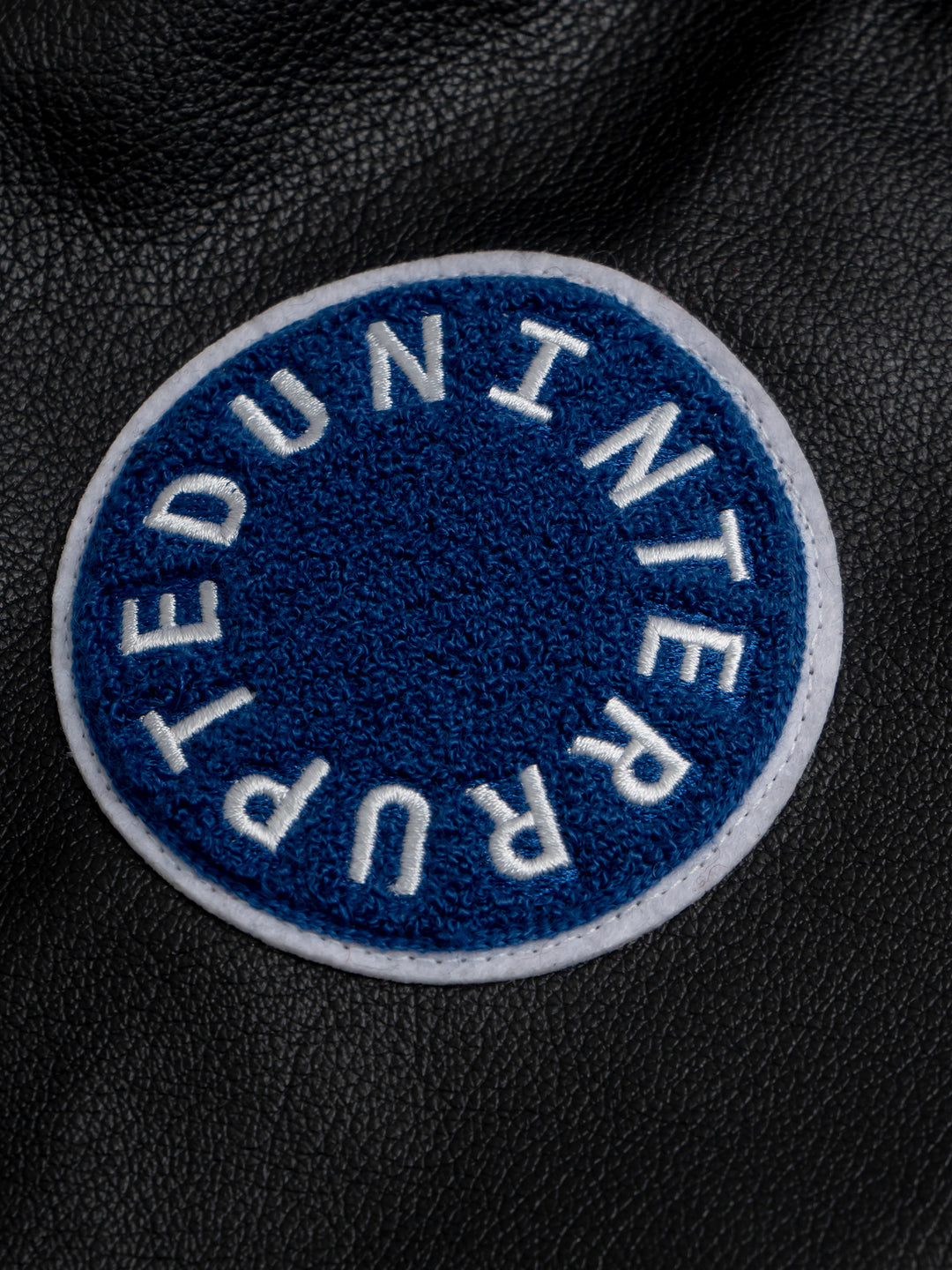 close up of the sleeve patch blue