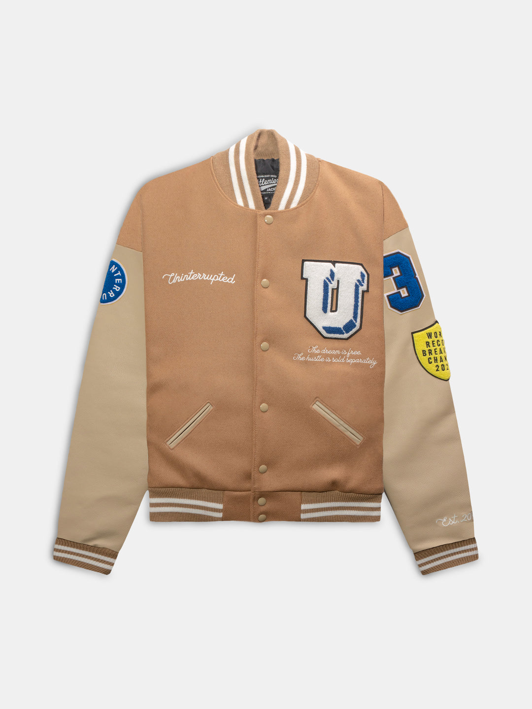 front view of the varsity jacket with several patches and leather sleeves