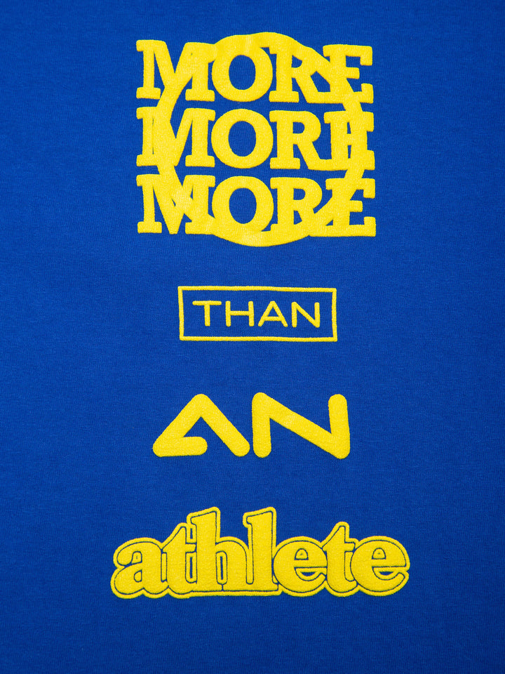 MORE THAN AN ATHLETE ATTRIBUTE TEE BLUE- details of the writing