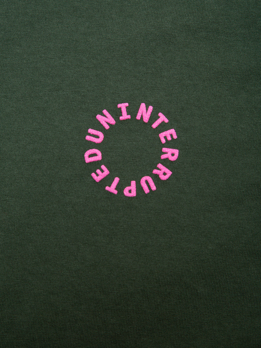 MORE THAN EMPOWERMENT ATTRIBUTE TEE GREEN - close up on uninterrupted pink logo