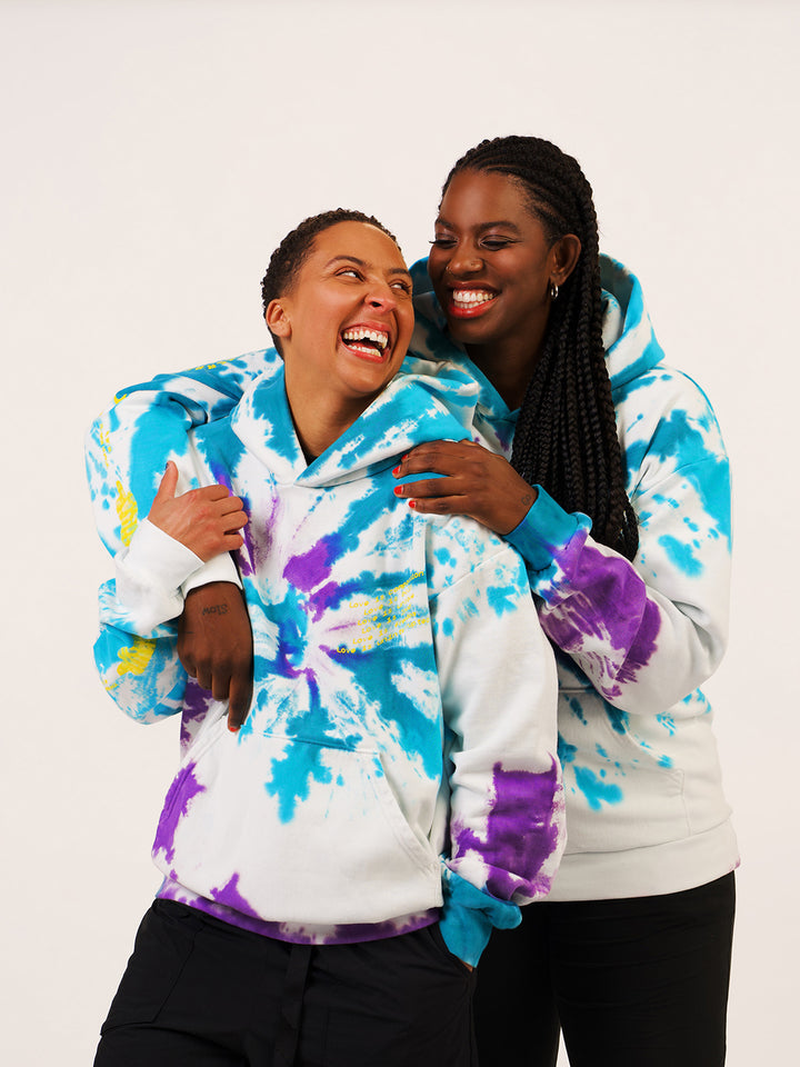 Love Is: Solidarity ASW Hoodie- two women hugging and laughing